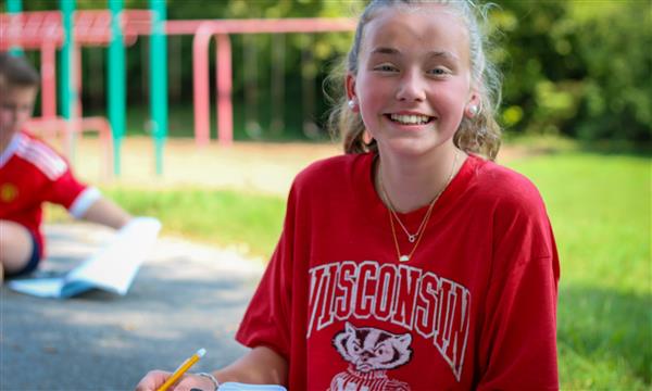student smiles at camera